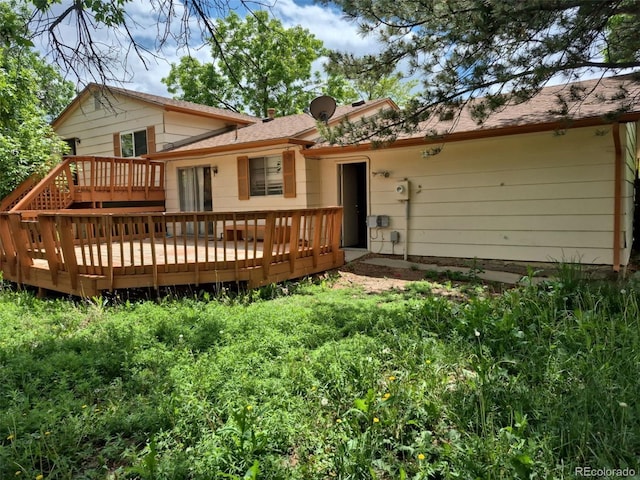 18249 E Mexico Pl, Aurora, CO 80017 - rear view of house with a wooden deck
