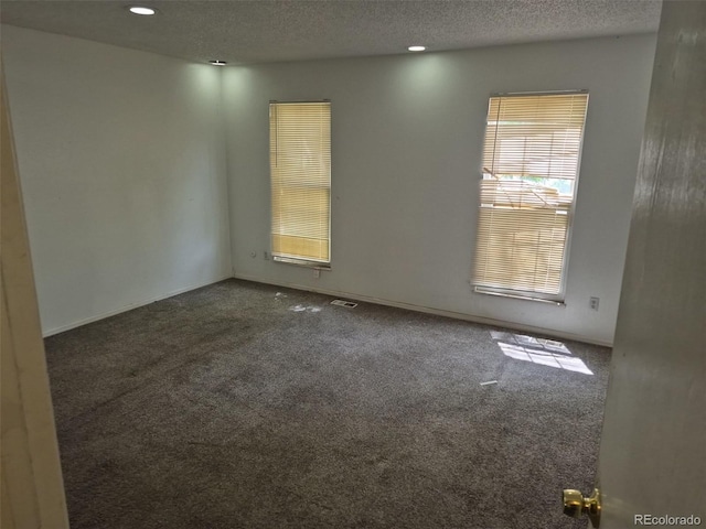 18249 E Mexico Pl, Aurora, CO 80017 - spare room featuring carpet floors, a textured ceiling, and recessed lighting