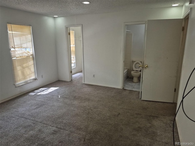 18249 E Mexico Pl, Aurora, CO 80017 - unfurnished bedroom with a textured ceiling, carpet floors, connected bathroom, and recessed lighting