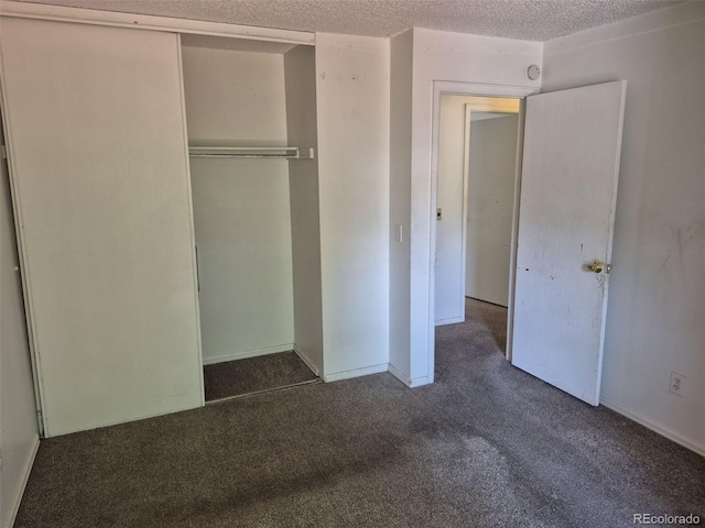18249 E Mexico Pl, Aurora, CO 80017 - unfurnished bedroom with carpet flooring, a closet, a textured ceiling, and baseboards