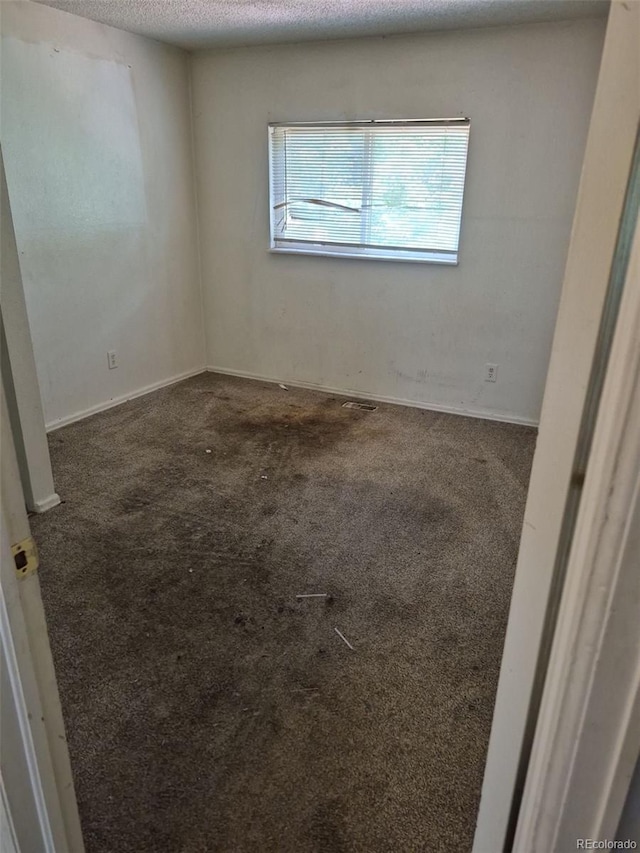 18249 E Mexico Pl, Aurora, CO 80017 - carpeted empty room with a textured ceiling