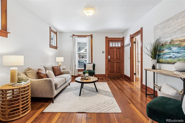 living room with dark hardwood / wood-style flooring