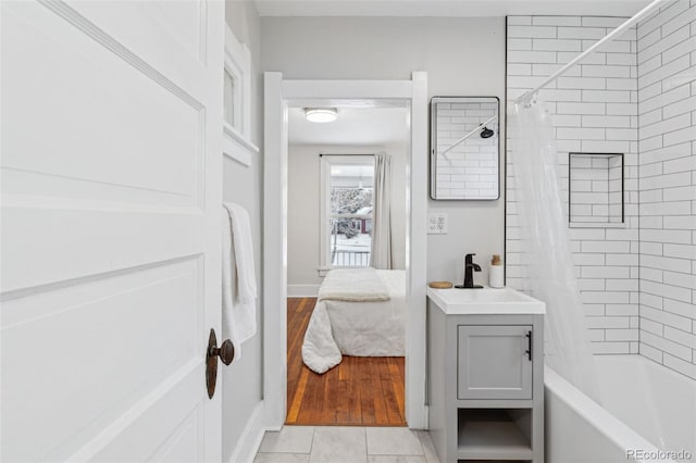 bathroom with vanity, tile patterned flooring, and shower / bathtub combination with curtain