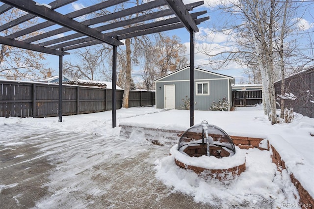 snowy yard featuring a pergola and a fire pit