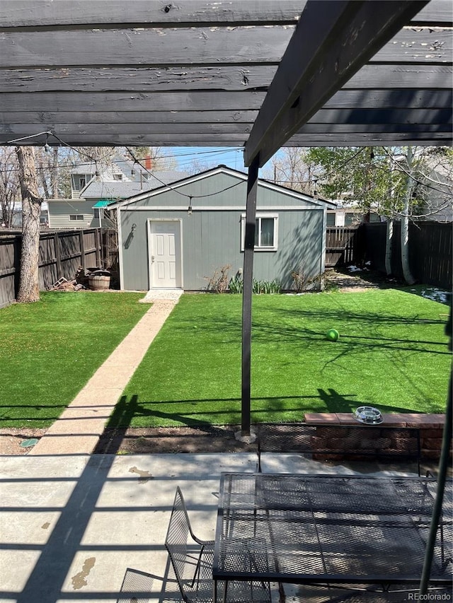 view of patio featuring an outbuilding