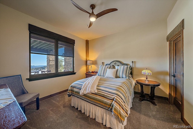 bedroom with ceiling fan and dark colored carpet