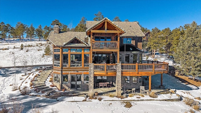 view of snow covered house