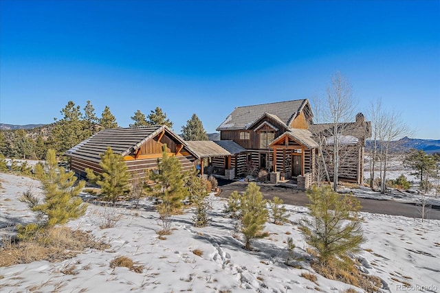 log cabin with a mountain view