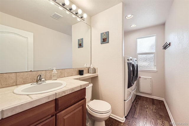 3744 Gypsum Ct, Superior, CO 80027 - bathroom featuring vanity, toilet, baseboards, wood finished floors, and visible vents