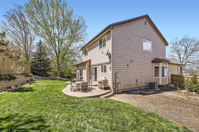 3744 Gypsum Ct, Superior, CO 80027 - back of house with a lawn, a patio, and a fenced backyard
