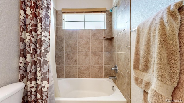 14230 Lakeview Ln, Broomfield, CO 80023 - full bathroom with shower / bath combo with shower curtain and a textured wall