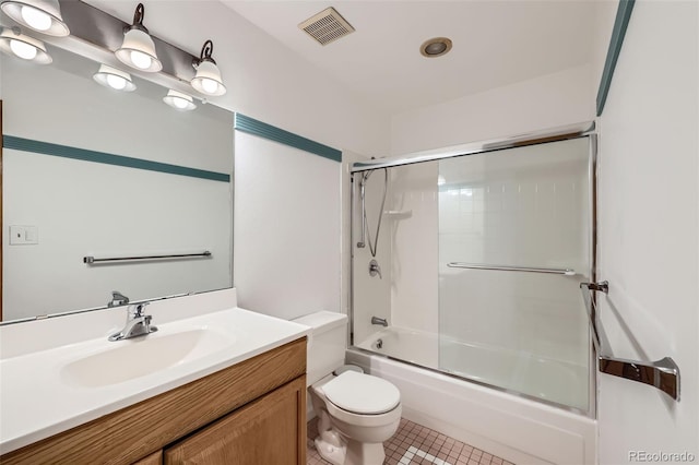 800 Illinois St Unit 1, Golden, CO 80401 - full bathroom featuring toilet, vanity, combined bath / shower with glass door, and tile patterned flooring