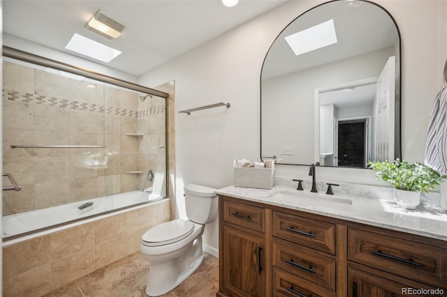 1219 S Yosemite Way Unit 63, Denver, CO 80247 - full bathroom featuring a skylight, vanity, tiled shower / bath, and toilet