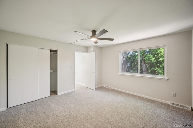 1219 S Yosemite Way Unit 63, Denver, CO 80247 - unfurnished bedroom with carpet floors, baseboards, a closet, and ceiling fan