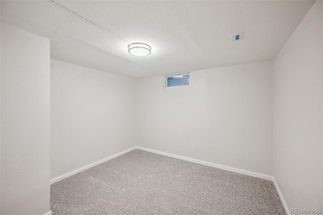 1219 S Yosemite Way Unit 63, Denver, CO 80247 - finished basement with carpet floors, baseboards, and a textured ceiling