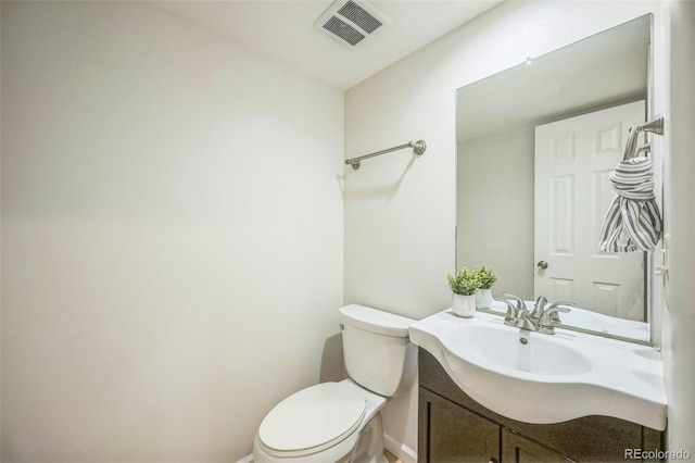 1219 S Yosemite Way Unit 63, Denver, CO 80247 - bathroom with vanity, toilet, and baseboards