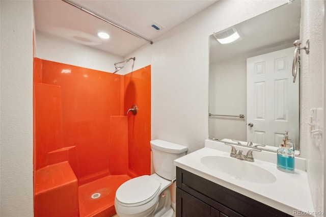 1219 S Yosemite Way Unit 63, Denver, CO 80247 - bathroom featuring toilet, vanity, and a shower