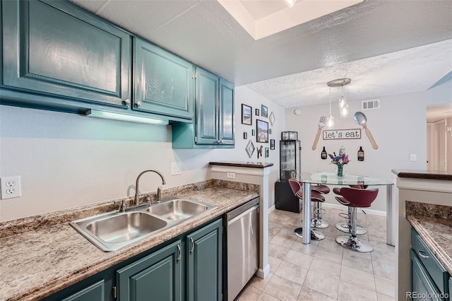 kitchen with light tile patterned flooring, sink, a textured ceiling, dishwasher, and pendant lighting