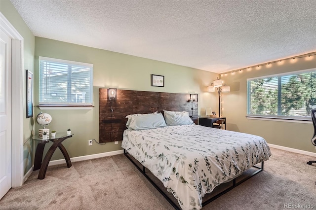 carpeted bedroom with a textured ceiling