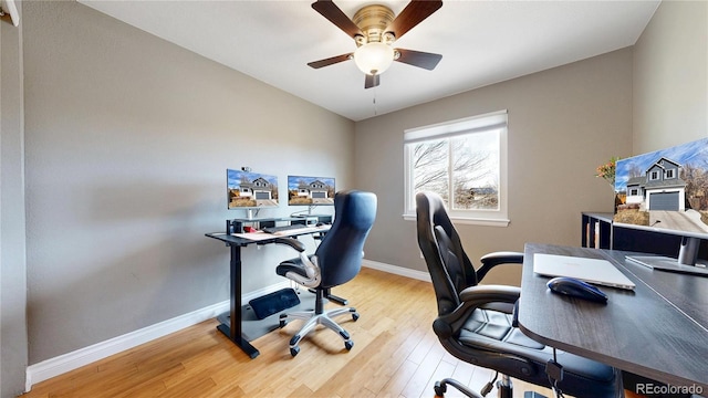 office space featuring ceiling fan, baseboards, and wood finished floors