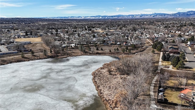 aerial view featuring a residential view and a water and mountain view