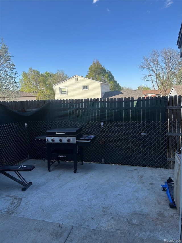 view of patio / terrace with fence and area for grilling