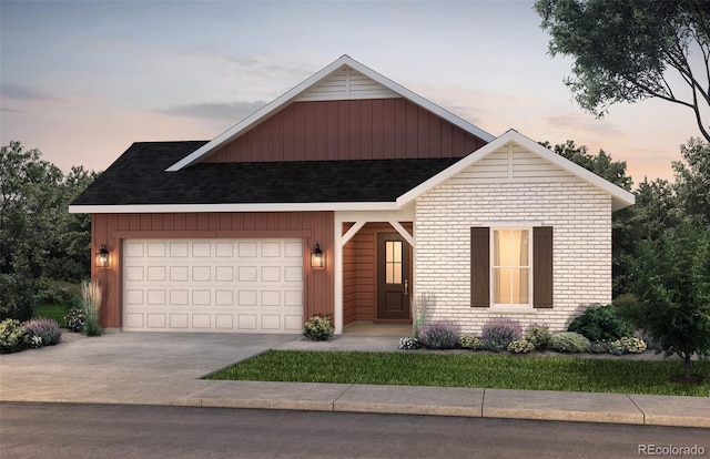 8664 S Quemoy St, Aurora, CO 80016 - view of front facade with driveway, an attached garage, and a shingled roof