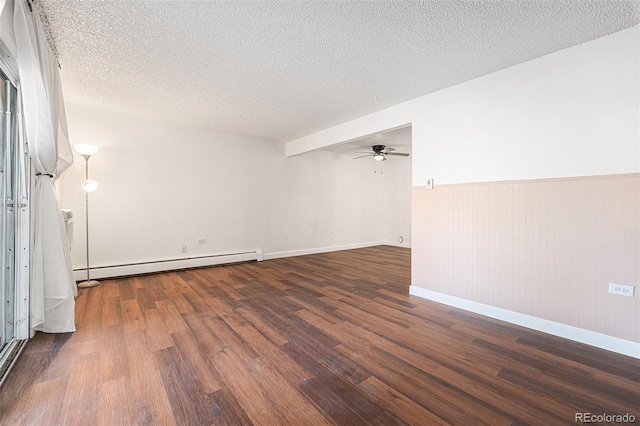 empty room with ceiling fan, a baseboard radiator, dark hardwood / wood-style floors, and a textured ceiling