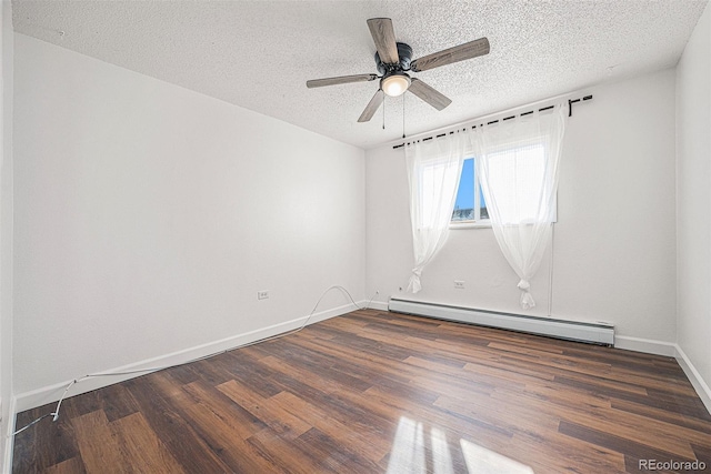 spare room featuring ceiling fan, a baseboard heating unit, a textured ceiling, and dark hardwood / wood-style flooring