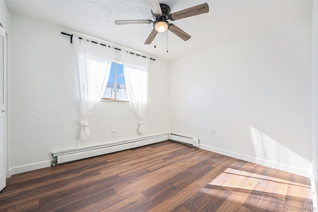 unfurnished room featuring a baseboard heating unit, dark hardwood / wood-style floors, a textured ceiling, and ceiling fan