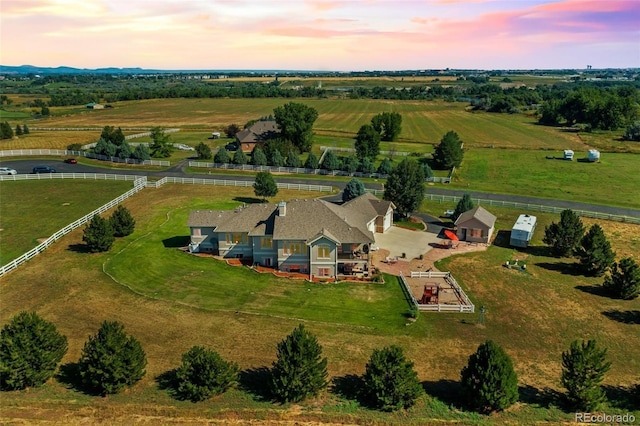 aerial view at dusk with a rural view