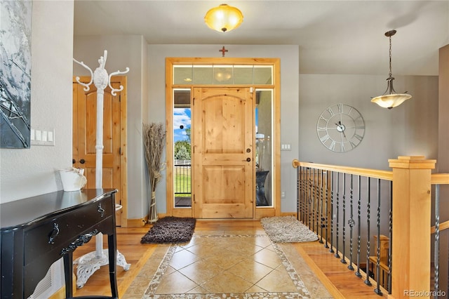 foyer entrance with tile patterned flooring