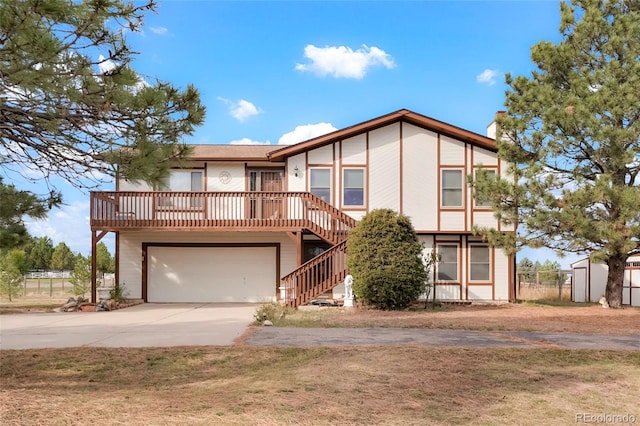 view of front facade with a garage and a deck