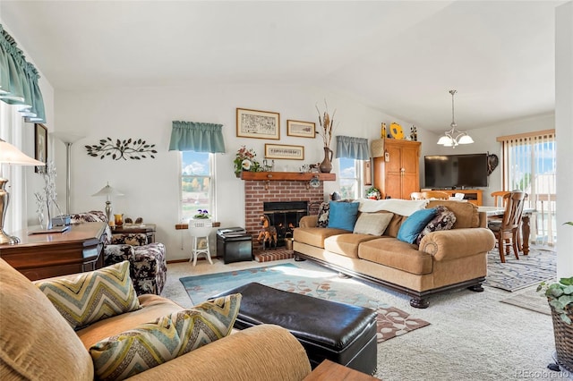 carpeted living room featuring plenty of natural light, lofted ceiling, and an inviting chandelier