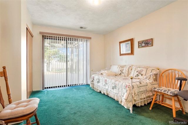 carpeted bedroom featuring access to outside and a closet