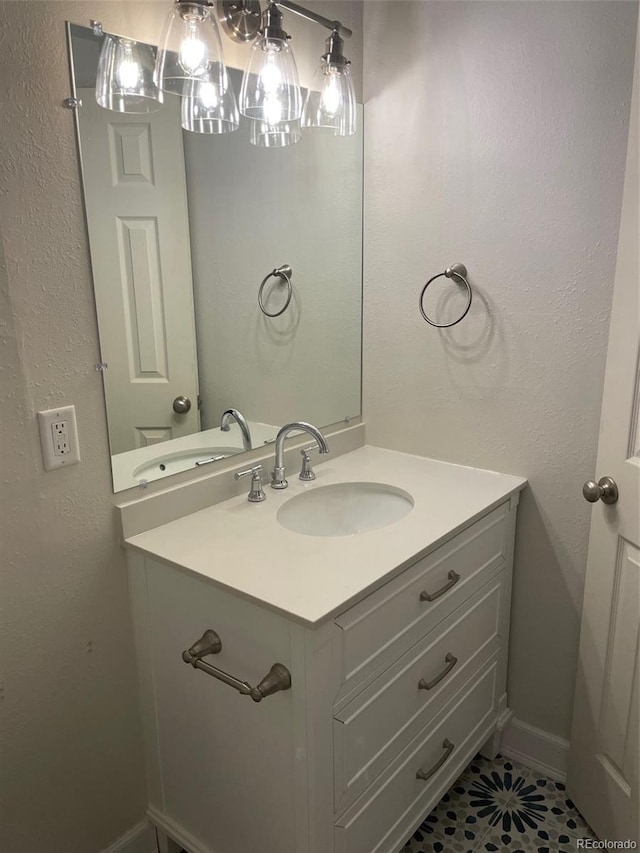 bathroom with vanity and tile patterned flooring