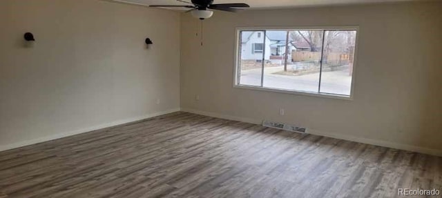 8001 Lowell Blvd, Westminster, CO 80031 - spare room featuring a ceiling fan, wood finished floors, baseboards, and visible vents