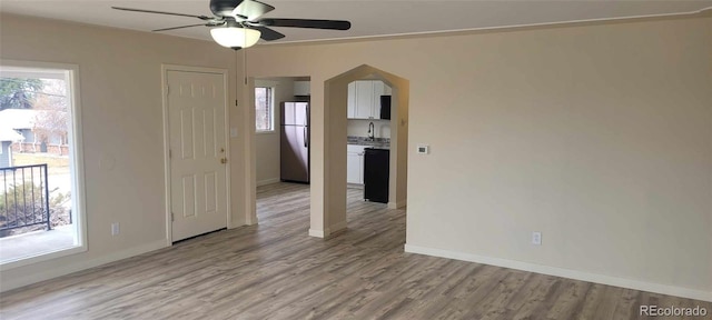 8001 Lowell Blvd, Westminster, CO 80031 - empty room with a sink, light wood-type flooring, baseboards, and ceiling fan