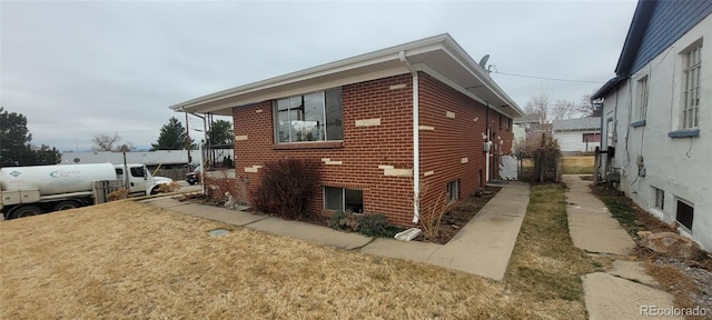 8001 Lowell Blvd, Westminster, CO 80031 - view of home's exterior featuring a yard and brick siding
