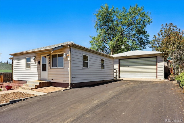 8881 Lilly Dr, Thornton, CO 80229 - view of front of home featuring an outdoor structure and a detached garage