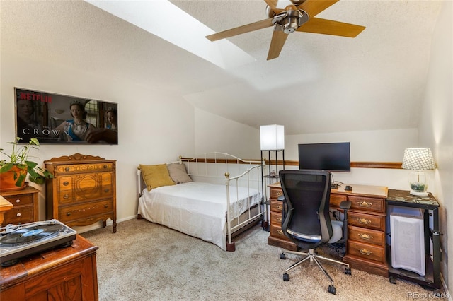 bedroom with carpet flooring, vaulted ceiling, a desk, and ceiling fan