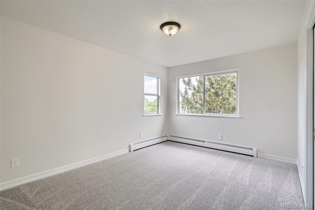 6335 Oberon Rd, Arvada, CO 80004 - spare room with carpet floors, a baseboard heating unit, and baseboards