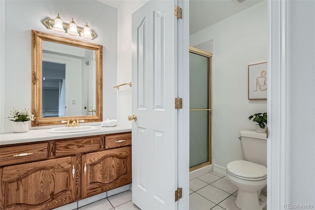 6335 Oberon Rd, Arvada, CO 80004 - full bathroom featuring tile patterned floors, toilet, a shower stall, and vanity