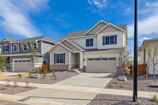 25234 E Warren Pl, Aurora, CO 80018 - craftsman inspired home featuring board and batten siding, an attached garage, stone siding, driveway, and a shingled roof