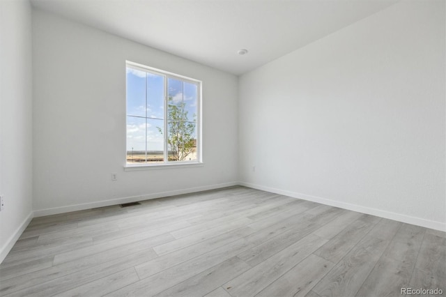 25234 E Warren Pl, Aurora, CO 80018 - unfurnished room featuring light wood finished floors and baseboards