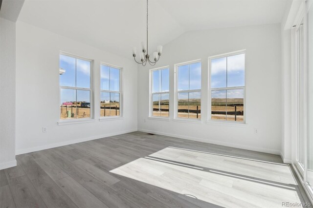 25234 E Warren Pl, Aurora, CO 80018 - unfurnished sunroom featuring a chandelier and lofted ceiling