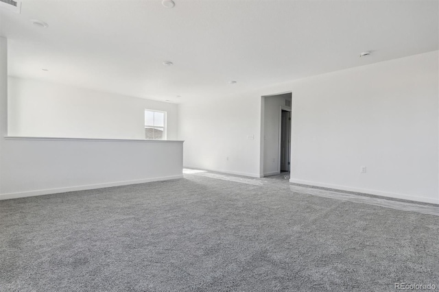 25234 E Warren Pl, Aurora, CO 80018 - spare room featuring carpet floors and baseboards