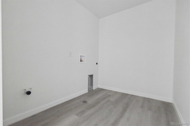 25234 E Warren Pl, Aurora, CO 80018 - washroom with hookup for an electric dryer, wood finished floors, washer hookup, and baseboards