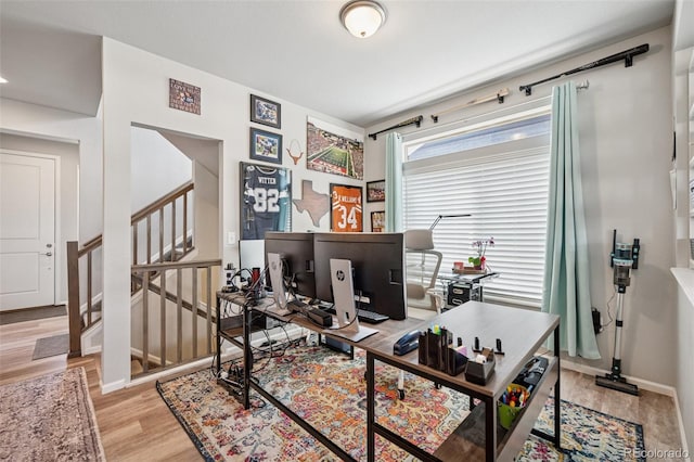office with light wood-style floors and baseboards