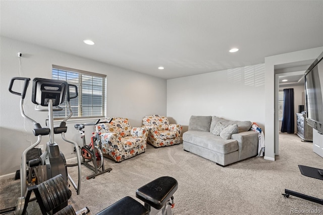 exercise area with carpet floors, baseboards, and recessed lighting
